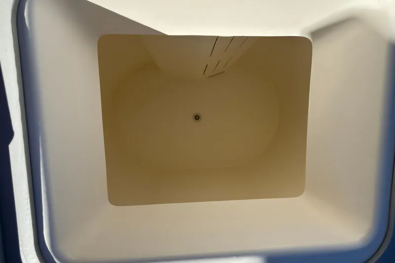 Slide: The Image of Empty storage compartment in 2026 Defiance Admiral 220 EX boat. - 20