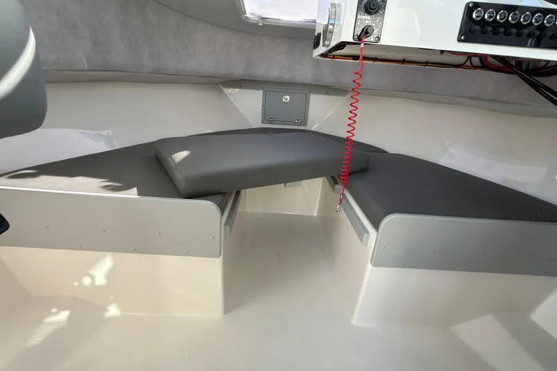 Slide: The Image of Interior of 2026 Defiance Admiral 220 EX boat with cushioned seating. - 32