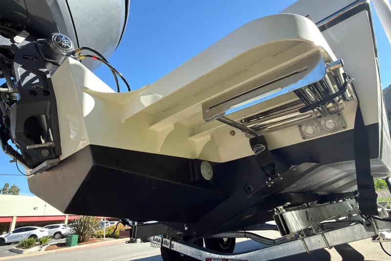 Slide: The Image of 2026 Defiance Admiral 220 EX boat stern with motor and ladder, viewed from below. - 8