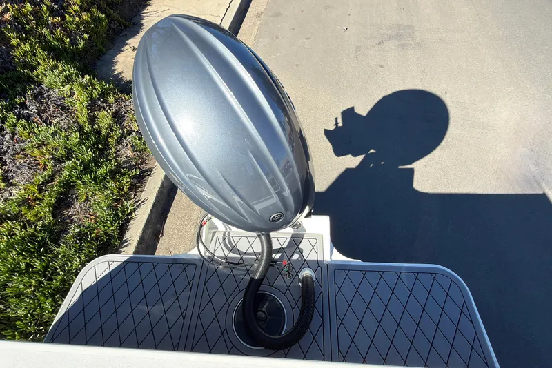 Slide: The Image of 2026 Defiance Admiral 220 EX boat engine with shadow on pavement. - 9