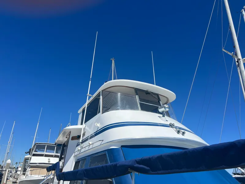 Slide: The Image of 1986 Gulfstar 44 Aft Cabin yacht docked under clear blue sky. - 10