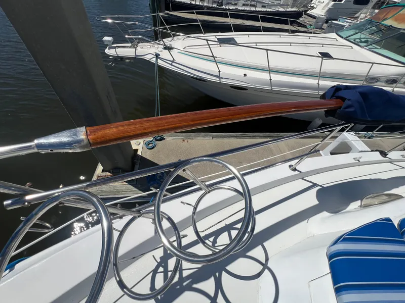 Slide: The Image of 1986 Gulfstar 44 Aft Cabin yacht docked, featuring polished wood and metal details. - 17