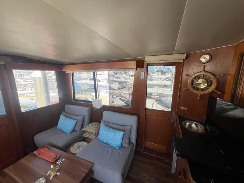 Slide: The Image of Interior of 1986 Gulfstar 44 Aft Cabin with cozy seating and nautical decor. - 21