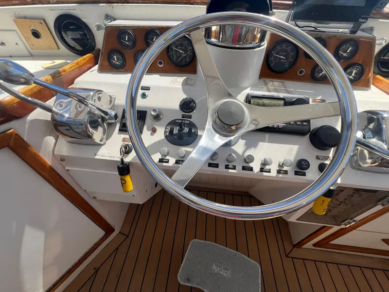 Slide: The Image of Steering wheel and controls of a 1986 Gulfstar 44 Aft Cabin yacht. - 35