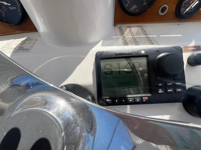 Slide: The Image of Control panel of 1986 Gulfstar 44 Aft Cabin with Simrad display and gauges. - 39