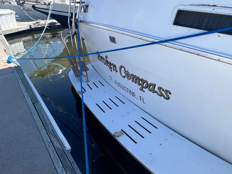 Slide: The Image of 1986 Gulfstar 44 Aft Cabin yacht docked, featuring "Golden Compass" name and St. Augustine, FL location. - 5