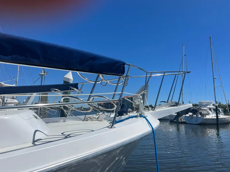 Slide: The Image of 1986 Gulfstar 44 Aft Cabin yacht docked in a sunny marina. - 8