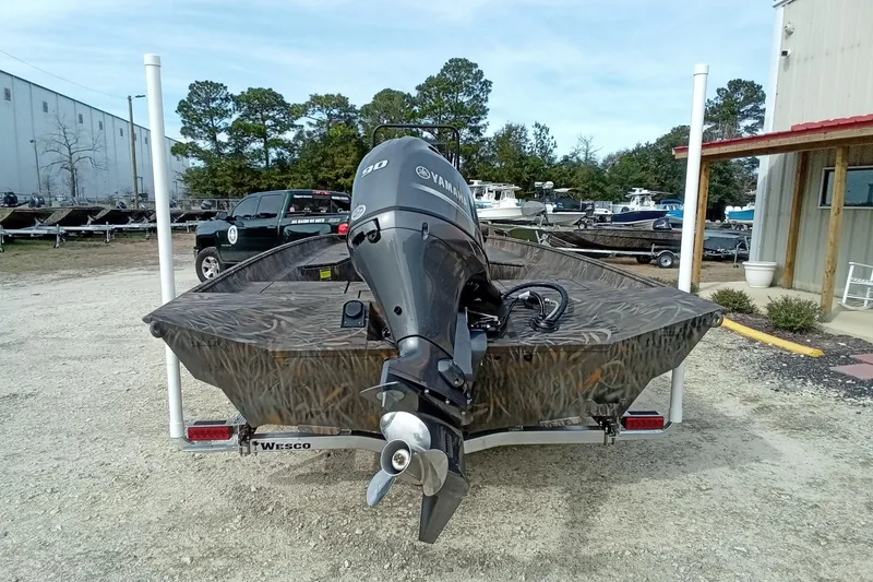 Slide: The Image of 2026 Alweld 2070 Vortex boat with Yamaha motor on trailer, outdoor setting. - 11