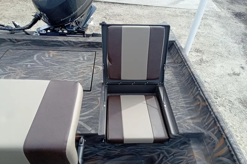 Slide: The Image of 2026 Alweld 2070 Vortex boat interior with brown and beige seating. - 14