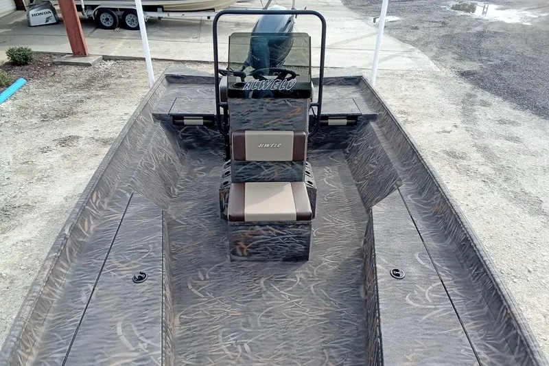 Slide: The Image of 2026 Alweld 2070 Vortex boat with camouflage interior design, parked outdoors. - 15