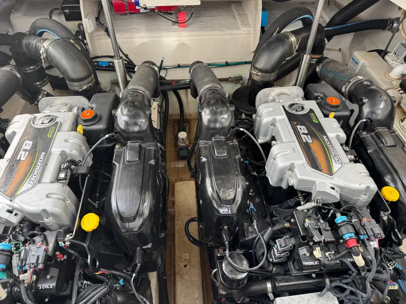 Slide: The Image of Twin engines in a 2012 Sea Ray 370 Sundancer boat engine room. - 25