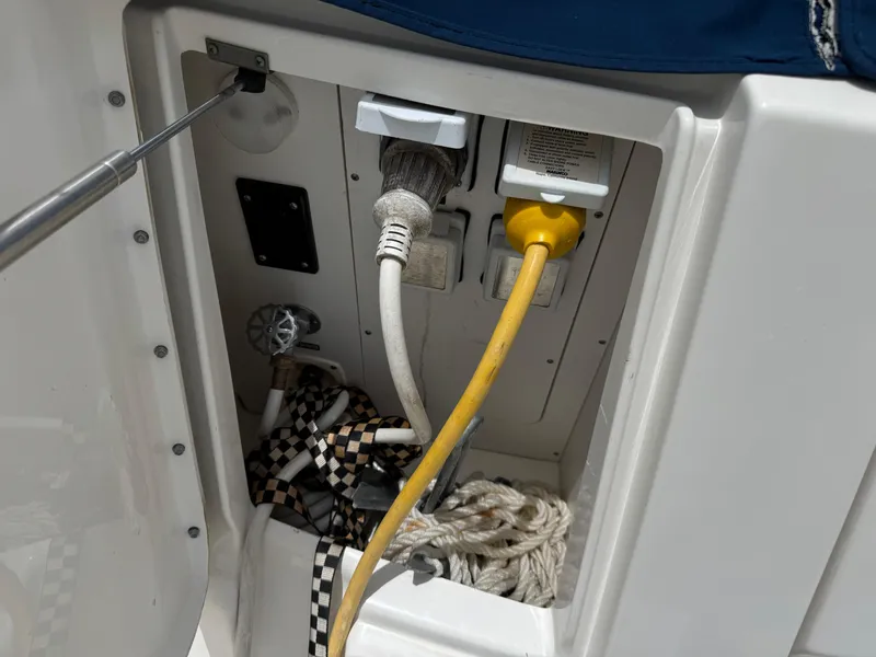 Slide: The Image of Electrical compartment of 2012 Sea Ray 370 Sundancer with cables and ropes. - 26
