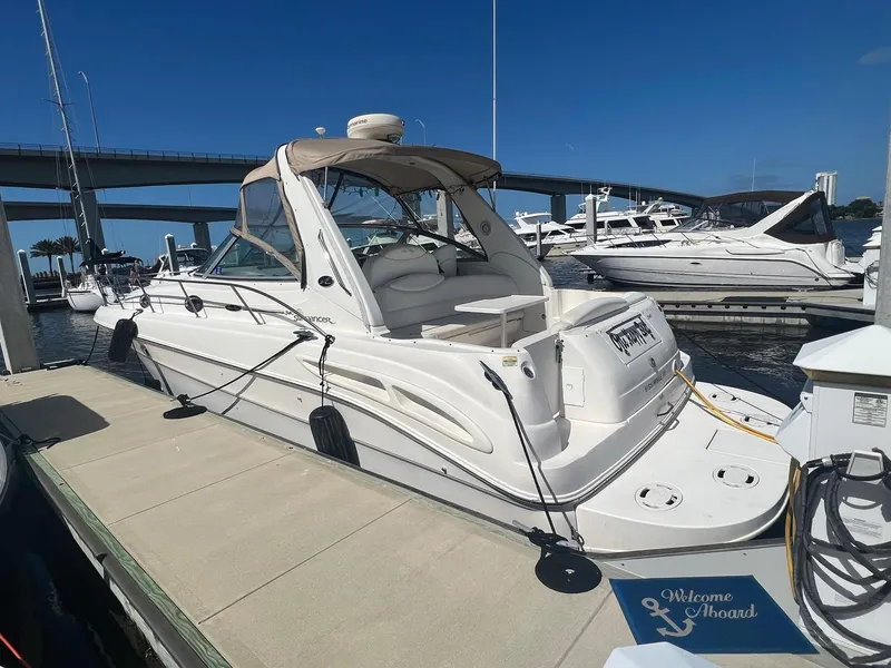 Slide: The Image of 2002 Sea Ray 340 Sundancer docked at marina under clear blue sky. - 3