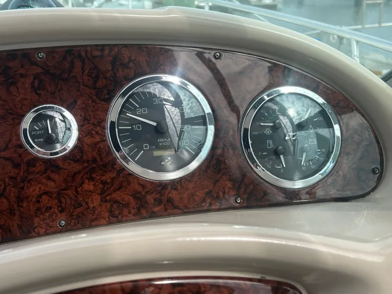 Slide: The Image of Dashboard of 2003 Sea Ray 320 Sundancer with wood finish and analog gauges. - 20