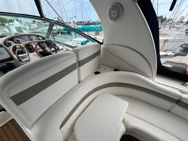 Slide: The Image of Luxurious interior of 2003 Sea Ray 320 Sundancer yacht with plush seating and modern dashboard. - 35