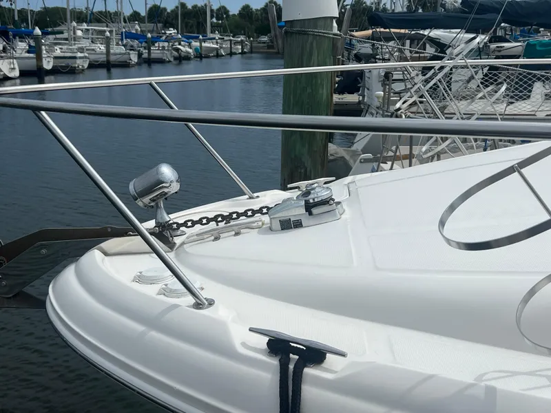 Slide: The Image of Bow of 2003 Sea Ray 320 Sundancer yacht docked at marina. - 8