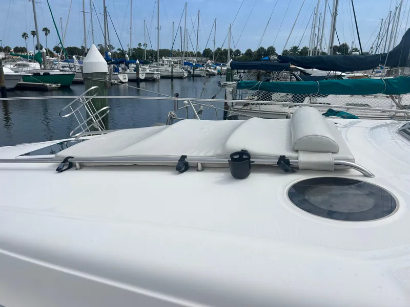 Slide: The Image of 2003 Sea Ray 320 Sundancer yacht with sunpad, docked in marina. - 9