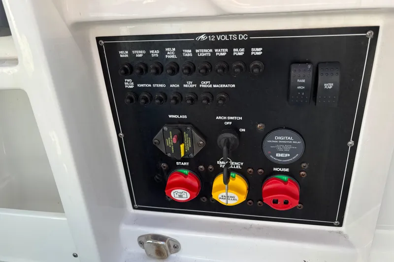Slide: The Image of Control panel of a 2019 Monterey 298SS Super Sport boat with various switches and indicators. - 22