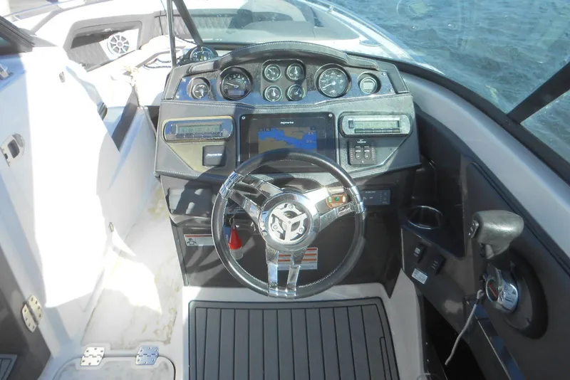 Slide: The Image of Cockpit view of 2019 Monterey 298SS Super Sport boat with steering wheel and dashboard controls. - 5