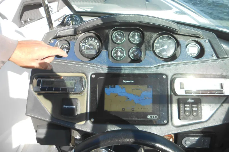 Slide: The Image of Dashboard of a 2019 Monterey 298SS Super Sport boat with navigation system. - 7