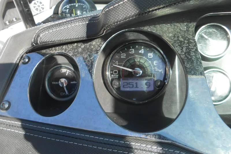Slide: The Image of Dashboard of a 2019 Monterey 298SS Super Sport boat showing RPM and trim gauges. - 8