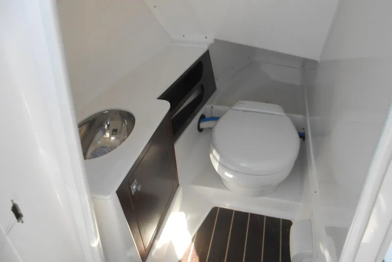 Slide: The Image of 2019 Monterey 298SS Super Sport boat bathroom with toilet and sink. - 9