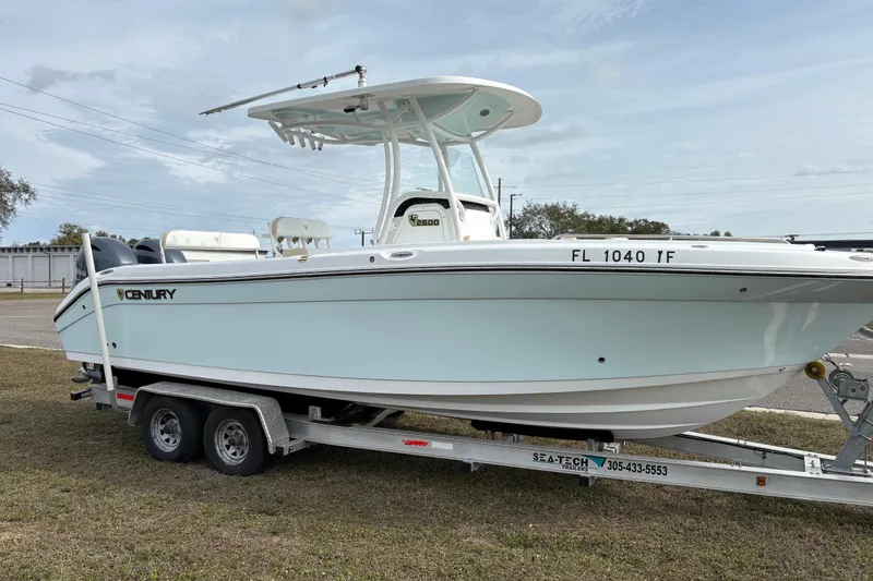 The Image of 2022 Century 2600 Center Console boat on trailer, side view. - 0