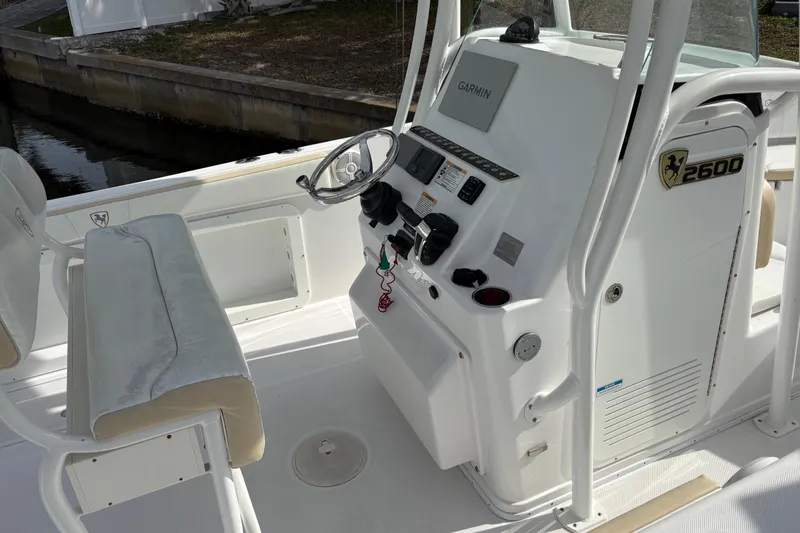 Slide: The Image of 2022 Century 2600 Center Console boat interior with steering wheel and control panel. - 12