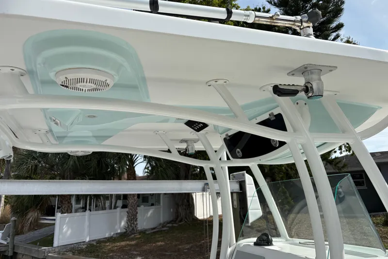 Slide: The Image of 2022 Century 2600 Center Console boat with T-top and mounted speakers. - 14