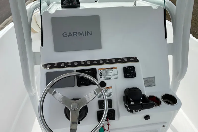 Slide: The Image of Century 2600 Center Console 2022 boat dashboard with Garmin navigation system. - 15