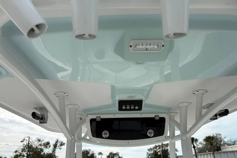Slide: The Image of 2022 Century 2600 Center Console boat's T-top with rod holders and LED lighting. - 22