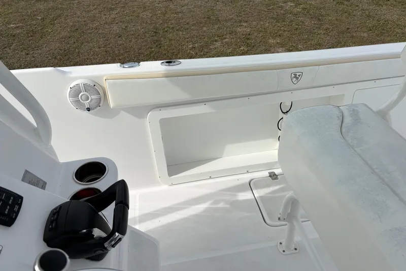 Slide: The Image of 2022 Century 2600 Center Console boat interior with seating and control panel. - 27