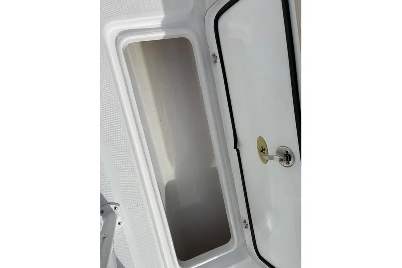 Slide: The Image of Open storage compartment on a 2022 Century 2600 Center Console boat. - 28