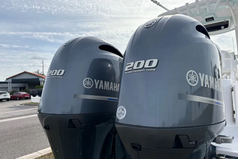 Slide: The Image of Twin Yamaha 200 outboard engines on a 2022 Century 2600 Center Console boat. - 29