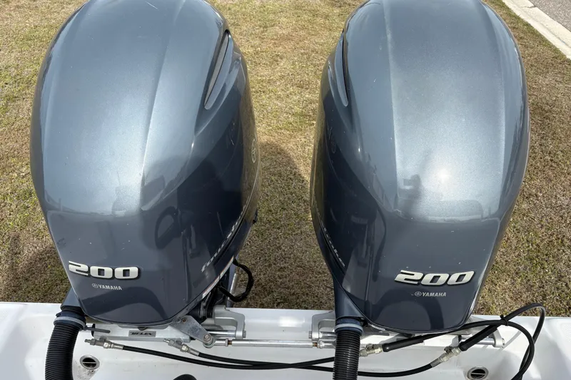 Slide: The Image of Twin Yamaha 200 outboard engines on a 2022 Century 2600 Center Console boat. - 30