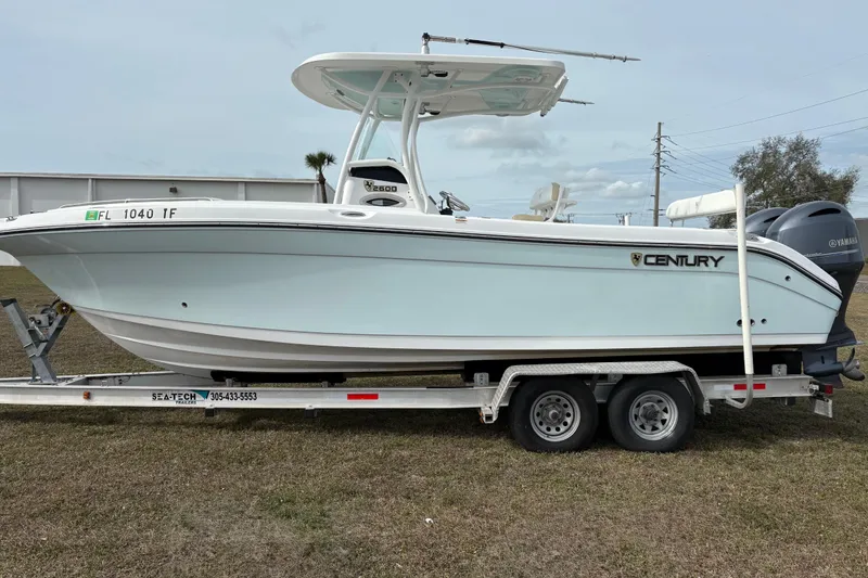Slide: The Image of 2022 Century 2600 Center Console boat on trailer, side view, outdoors. - 6