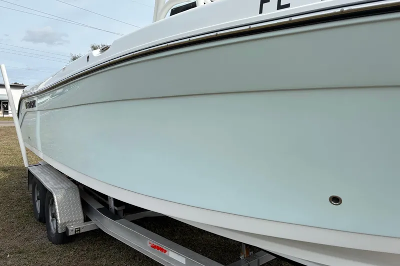 Slide: The Image of 2022 Century 2600 Center Console boat on trailer, side view. - 9