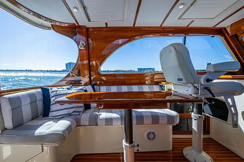 Slide: The Image of Luxurious 2008 Hinckley Talaria 44 MY yacht interior with elegant seating and polished wood finishes. - 10