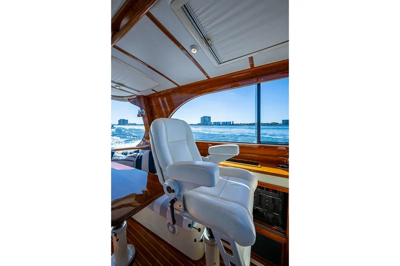 Slide: The Image of Interior of 2008 Hinckley Talaria 44 MY yacht with white captain's chair and ocean view. - 11