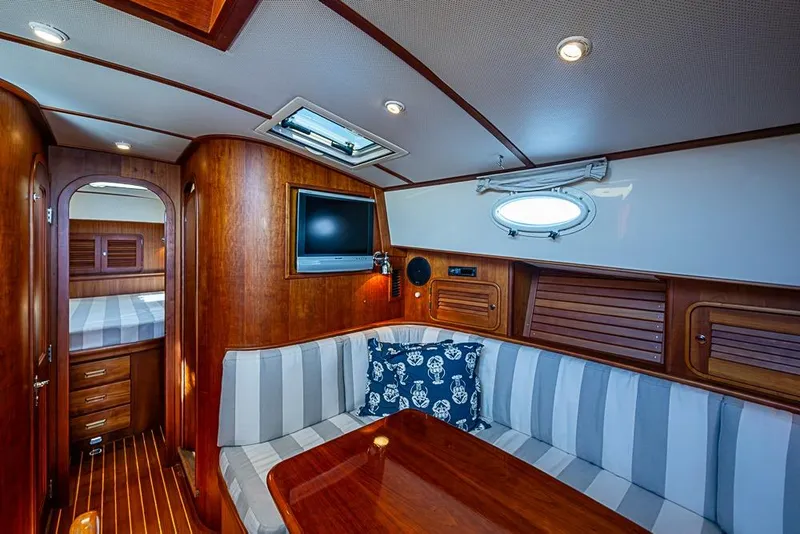 Slide: The Image of Luxurious 2008 Hinckley Talaria 44 MY yacht interior with elegant wood finish and cozy seating area. - 19