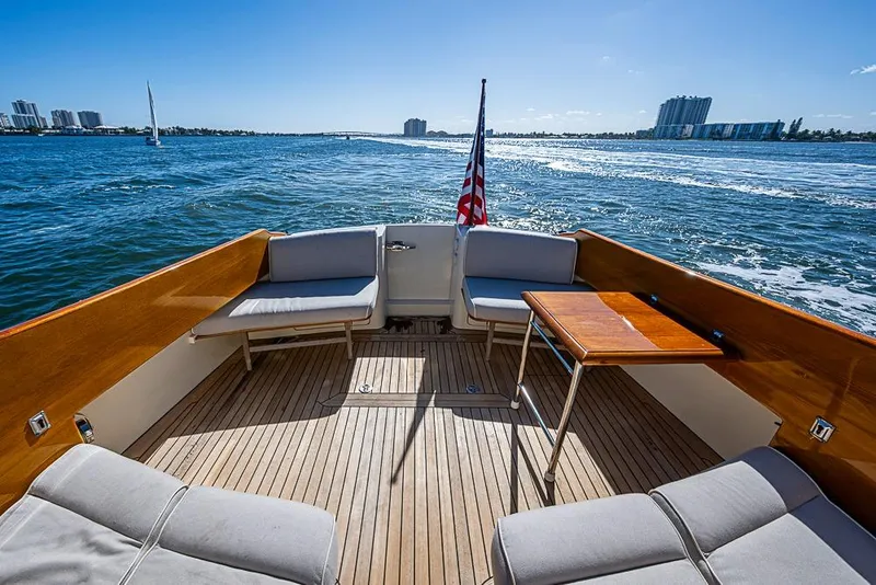 Slide: The Image of Hinckley Talaria 44 MY 2008 yacht deck with seating, table, and ocean view. - 5