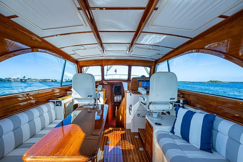 Slide: The Image of Luxurious 2008 Hinckley Talaria 44 MY yacht interior with elegant wood finish and scenic ocean view. - 18