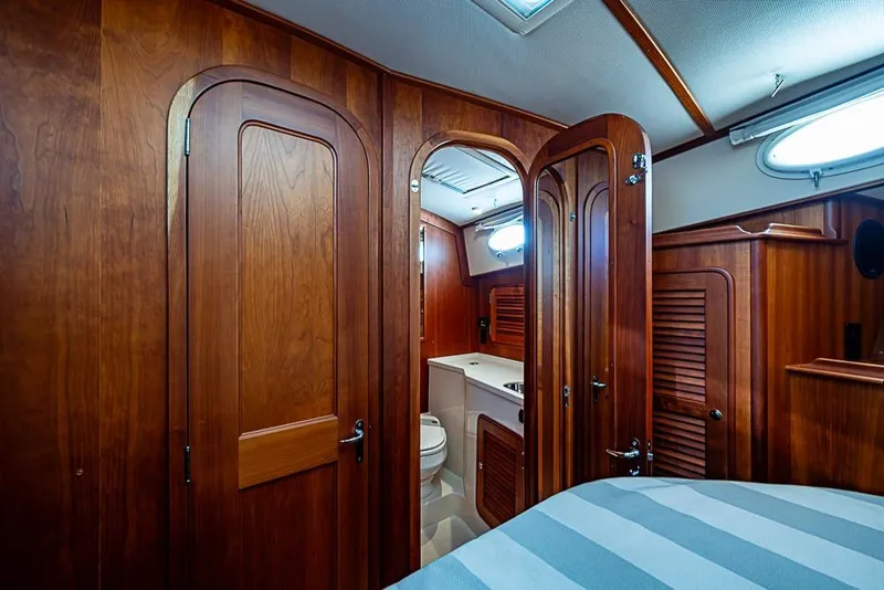 Slide: The Image of Luxurious wooden interior of 2008 Hinckley Talaria 44 MY yacht cabin with ensuite bathroom. - 24