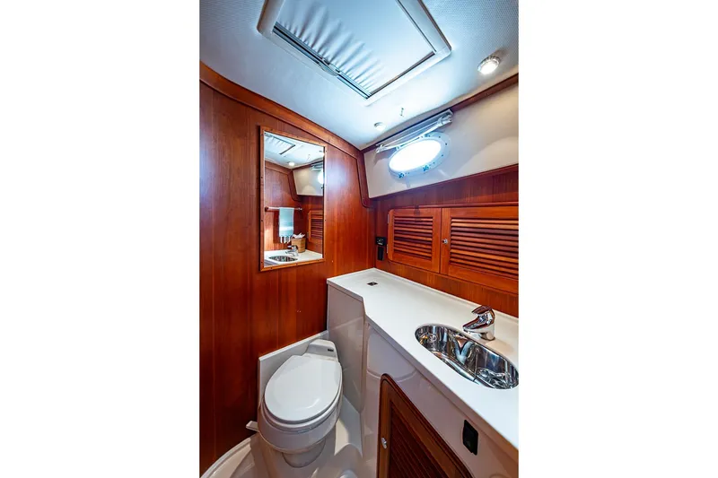 Slide: The Image of Luxurious 2008 Hinckley Talaria 44 MY yacht bathroom with wood paneling and modern fixtures. - 25