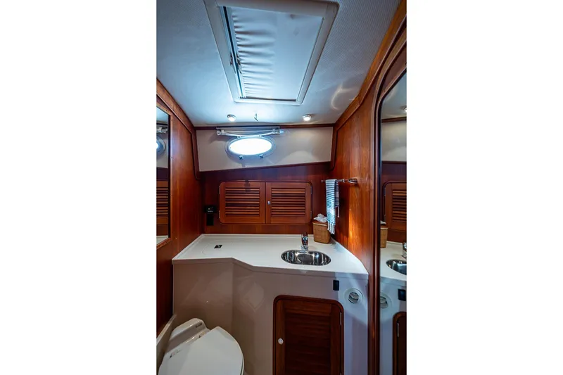 Slide: The Image of Luxurious bathroom interior of 2008 Hinckley Talaria 44 MY yacht with wood accents. - 26