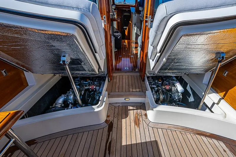 Slide: The Image of Engine compartment of 2008 Hinckley Talaria 44 MY yacht with open hatches and visible machinery. - 30