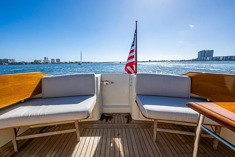 Slide: The Image of Hinckley Talaria 44 MY 2008 yacht deck with seating, American flag, ocean view. - 6