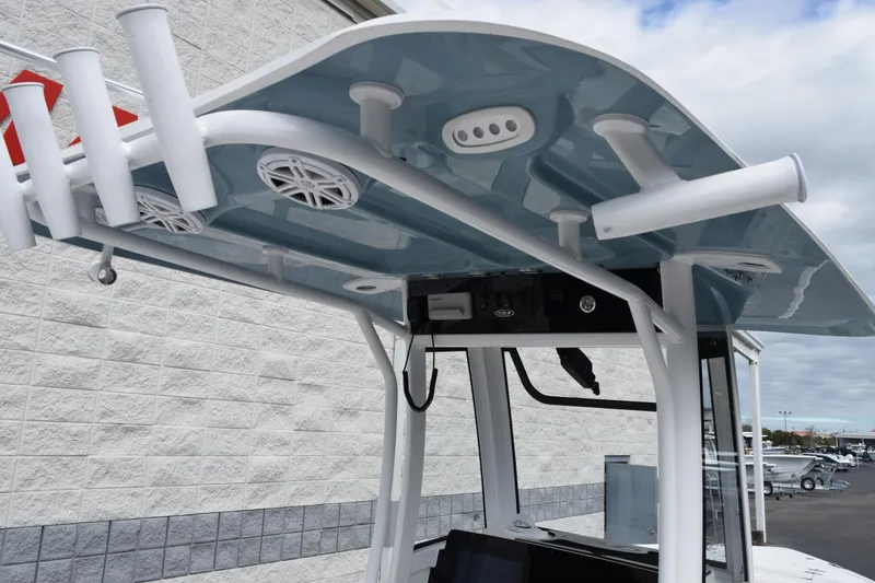 Slide: The Image of 2026 Sea Hunt Ultra 245 SE boat T-top with rod holders and speakers. - 9