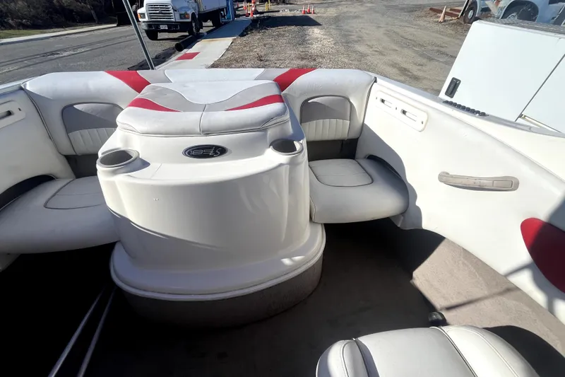 Slide: The Image of 2007 Stingray 185 LS/LX boat interior with white seating and steering wheel. - 10