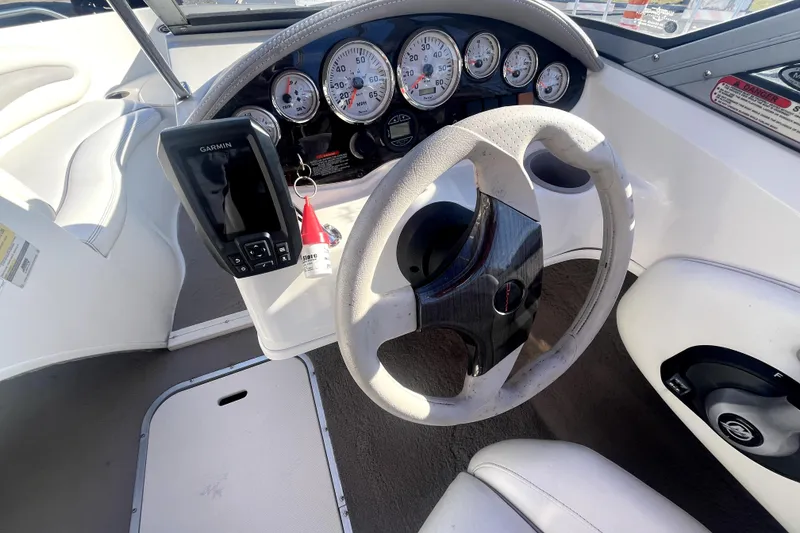 Slide: The Image of 2007 Stingray 185 LS/LX boat interior with white seating and red accents. - 15